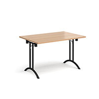 Rectangular folding leg table with black legs and curved foot rails 1200mm x 800mm - beech