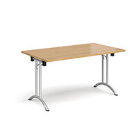 Rectangular folding leg table with silver legs and curved foot rails 1400mm x 800mm - oak