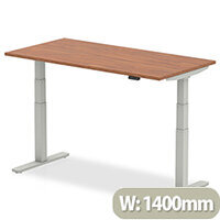 Air Electric Height Adjustable Rectangular Sit Stand Desk Plain Top W1400xD800xH660-1310mm Walnut Top Silver Frame Air Electric Height Adjustable Rectangular Sit Stand Desk Plain Top W1400xD800xH660-1310mm Walnut Top Silver Frame