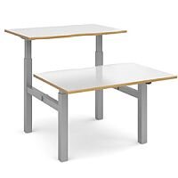 Elev8 Mono Height Adjustable Sit-Stand Back-To-Back Bench 2 Person Office Desk 1200mmx1650mm With Silver Frame & White Top With Oak Edge Elev8 Mono Height Adjustable Sit-Stand Back-To-Back Bench 2 Person Office Desk 1200mmx1650mm With Silver Frame & White Top With Oak Edge