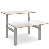 Elev8 Mono Height Adjustable Sit-Stand Back-To-Back Bench 2 Person Office Desk 1600mmx1650mm With Silver Frame & White Top With Oak Edge Elev8 Mono Height Adjustable Sit-Stand Back-To-Back Bench 2 Person Office Desk 1600mmx1650mm With Silver Frame & White Top With Oak Edge