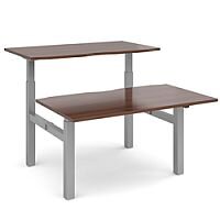 Elev8 Mono Height Adjustable Sit-Stand Back-To-Back Bench 2 Person Office Desk 1600mmx1650mm With Silver Frame & Walnut Top Elev8 Mono Height Adjustable Sit-Stand Back-To-Back Bench 2 Person Office Desk 1600mmx1650mm With Silver Frame & Walnut Top