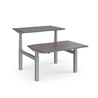 Elev8 Touch Electric Height Adjustable Rectangular Sit Stand 2 Person Back To Back Bench Desk with Scallop Cut Out W1200xD800(x2)xH675-1170mm Grey Oak Top Silver Frame